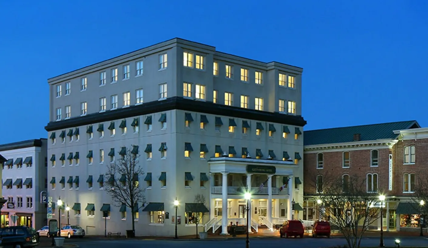 Evening view of the illuminated exterior of Gettysburg Hotel
